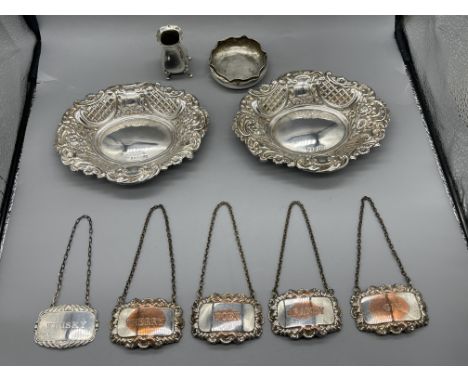 Pair of HM Silver Bon-Bon Dishes and other, along with four silver plated decanter labels. 
Total weight 220gr.