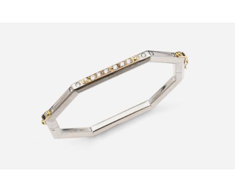 AN 18CT WHITE GOLD, DIAMOND AND SAPPHIRE OCTAGONAL-SHAPED HALF HINGED BANGLE mounted to one side with circular-cut diamonds a