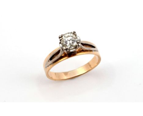 A DIAMOND SOLITAIRE RING set with a circular-cut diamond in 18ct gold. Size M 1/2