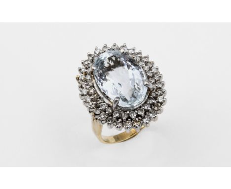 AN AQUAMARINE AND DIAMOND CLUSTER RING the oval-shaped aquamarine is set within a double surround of circular-cut diamonds, i