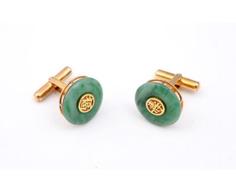 A PAIR OF JADE AND 18CT GOLD CUFFLINKS each formed with a jade disc centred with a gold Chinese character, in 18ct gold mount