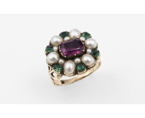 A GEORGIAN GOLD AND GEM SET CLUSTER RING the oval-shaped foil backed pink tourmaline is set within a surround of square-shape