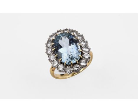 AN AQUAMARINE AND DIAMOND CLUSTER RING the oval-shaped aquamarine is set within a border of sixteen circular-cut diamonds in 