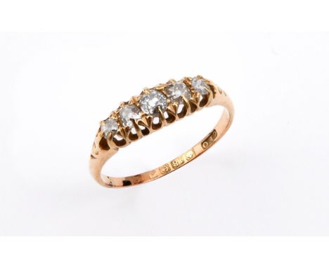 A DIAMOND FIVE STONE RING mounted with five graduated cushion-shaped old cut diamonds, in 18ct yellow gold. Size R