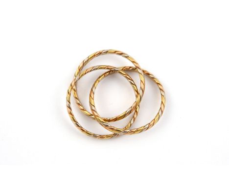 AN 18CT THREE COLOUR GOLD TRIPLE BAND RING formed as three interlocking gold bands, 8.1 grams. Size Q