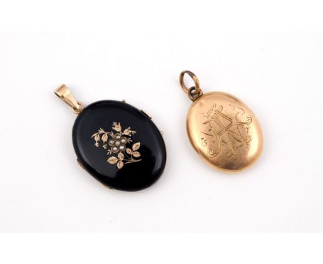 A BLACK ENAMEL AND GOLD LOCKET PENDANT of oval shape, the front with gold and pearl set foliate decoration, 2.5cm wide, toget