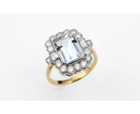 AN AQUAMARINE AND DIAMOND CLUSTER RING the cut cornered rectangular-shaped aquamarine is set within a surround of two baguett