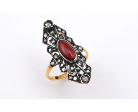 A GARNET AND DIAMOND CLUSTER RING the oval-shaped cabochon garnet is set within an openwork surround set with circular-cut di