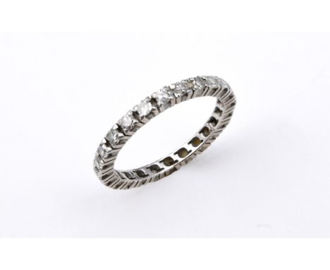 A DIAMOND FULL CIRCLE ETERNITY RING mounted with circular-cut diamonds. Size M