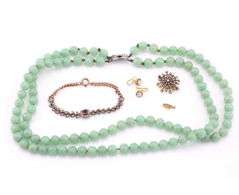 A lot consisted of a jade necklace, a seed pearl set brooch, a pair of pearl set earrings and a stone set bracelet. The doubl