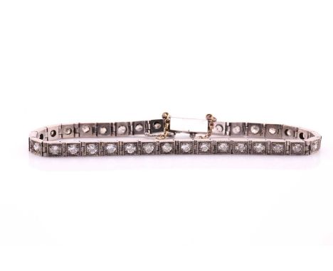 An old cut diamond line bracelet, consisting of thirty-two round old cut diamonds weighing approximately 1.60ct in total, set