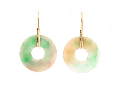 A pair of jade Pi earrings, with yellow precious metal hook fittings, 2.6cms diameter