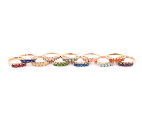 A collection of gem-set ringsEach set with five circular-cut gems such as garnet, fire opal, diopside, kyanite, padparadscha 