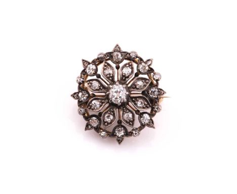 A Victorian old cut diamond set brooch/pendant, consisting of a central old cut diamond of an estimated weight of 0.36ct, sur