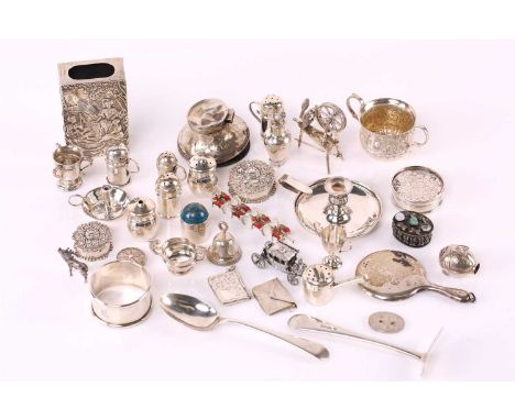 A small collection of miniature silver "Toy" figures and objects including envelope stamp case articulated spinning wheel, ty