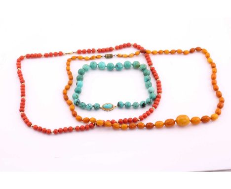 Red coral bead necklace, oval beads from 7.5-9mm wide, '375' stamped barrel clasp, 74cms long; a turquoise bead necklace, mos