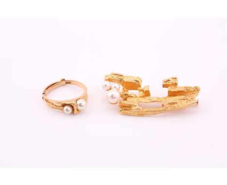 A textured, gold and cultured pearl brooch and ring, consisting of a bark textured brooch measuring approximately 45x 20mm se
