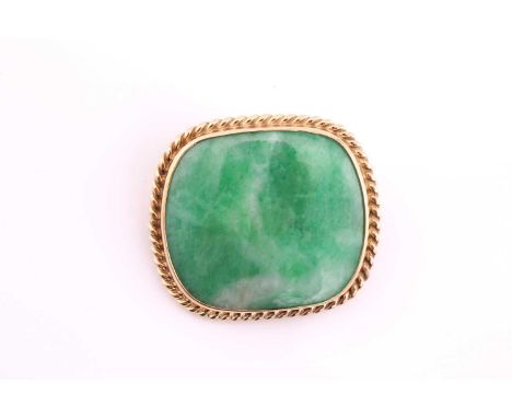 A cushion shape jade cabochon brooch, within a yellow precious metal ropetwist surround, pin fitting, 3.4 by 3cmsCondition re