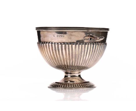 A Victorian silver oval tea caddy, the hinged cover engraved with a monogram, the part reeded body with the original key on f