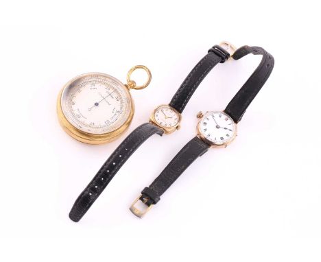 A lot consisting of a pocket barometer a trench watch and a lady's wristwatch. The pocket barometer is cased in gilt metal an