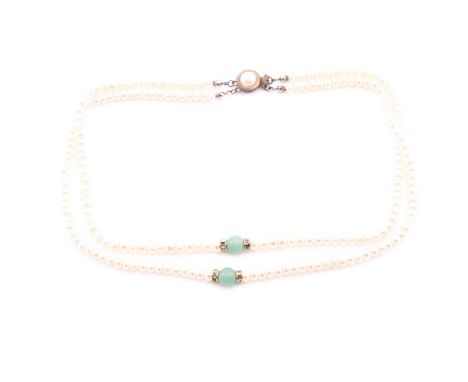 Charity lot South Bucks HospiceA double string of freshwater pearls and jade beads, the necklace measureses 45cm at its short