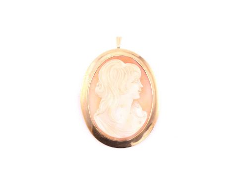 An Italian shell cameo brooch, the oval panel with female portrait in profile, yellow precious metal mount, pin fitting and s