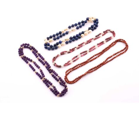 Four bead necklaces, one in coral, one amethyst, one lapis lazuli and pearl, one rhodonite and pearl, the amethyst strand in 