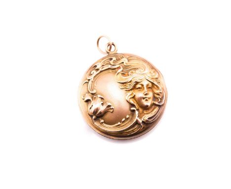 An Art Nouveau locket pendant, measuring 30mm approximately across, featuring a silhouette female figure with and plain case 