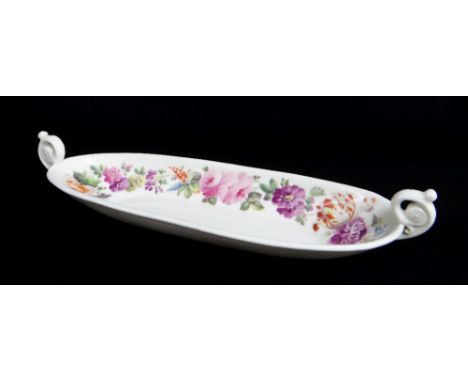 Oval with spurred scroll handles with floret discs, the sides of the interior painted by Thomas Pardoe with a variety of flow