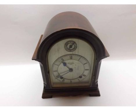 A first half of the 20th Century Mahogany Cased Mantel Clock, S Smith & Son Ltd - Trafalgar Square, London, the arched case w