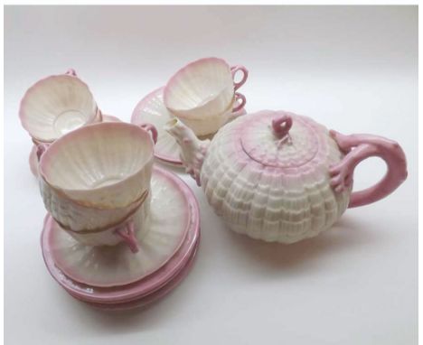 A Belleek Shell moulded Tea Service, comprising a Tea Pot, six Cups, and two Saucers, Sugar Bowl and five Tea Plates, all wit