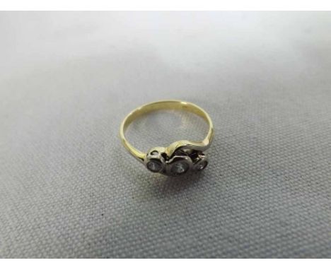 A high grade precious metal Ring set with three small Brilliant Cut Diamonds, stamped ",750"