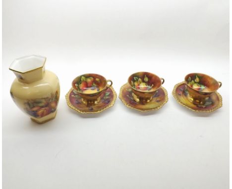 Three Caverswall hand-painted Cups and Saucers, decorated with various stylised fruit, signed D Millar; together with a furth