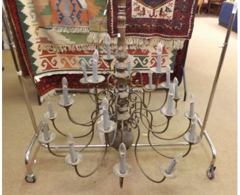 Large three-tier 21 light Dutch style Electrolier, the metal body with burnished finish and stylised floral decoration, 46" d