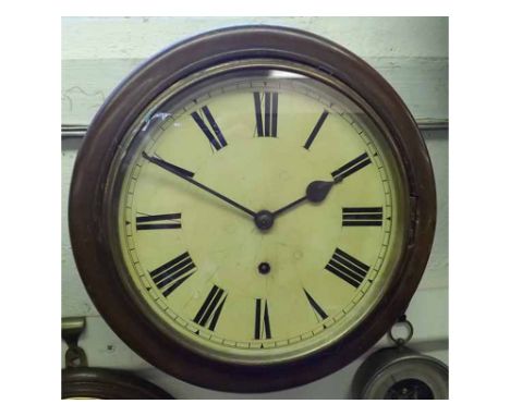 An early 20th Century dial Timepiece, the quartered and stained surround to a spun Brass bezel enclosing a 9" painted Roman d