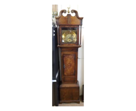 A Walnut cross banded, Oak cased, Longcase Clock, Brass dial Robt Scholfield, applied at the corners with Rococo spandrels an