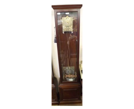 A modern Mahogany floor-standing Clock Case with overhanging cornice, glazed and hinged trunk door and further glazed side pa