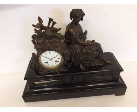 A late 19th Century French patinated spelter and black marble figural Mantel Clock, the plinth shaped base with panelled deta