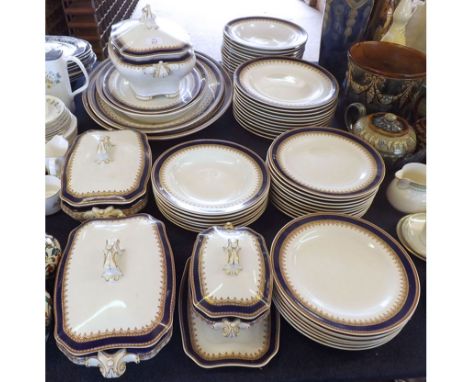 A quantity of Royal Worcester Vitreous Tableware, decorated with blue and gilt highlighted border, comprising: large Soup Tur