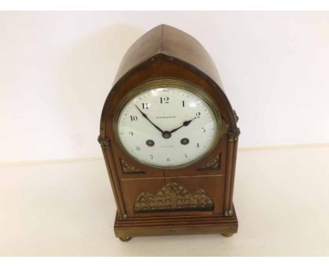 An early 20th Century Mahogany and Brass Detailed Mantel Clock, retailed by Maple & Co Ltd - Paris & London, the lancet-shape