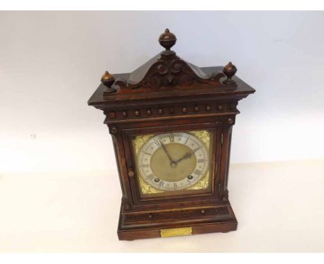 A late 19th Century Oak cased Bracket Clock, Winterhalder & Hofmeier, the case with overhanging cornice surmounted by a shape