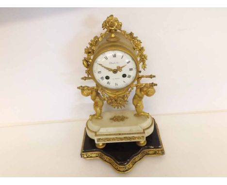 A mid-19th Century French gilt Brass and white marble Mantel Clock, signed "Dutertre-A Paris", the drum shaped case surmounte