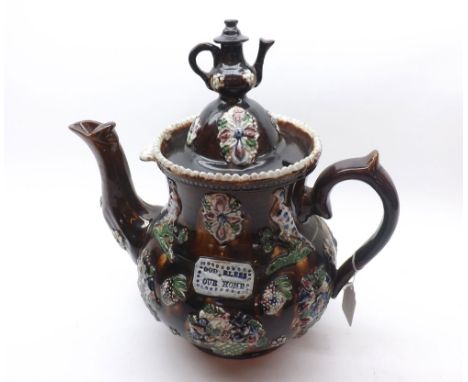 A Bargee Teapot "God Bless Our Home", typically moulded with birds and flowers, (restored/repaired lid and other losses), 13 
