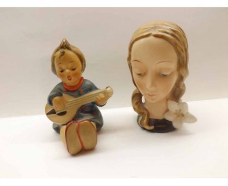 A Mixed Lot comprising: a Hummel Model of a boy playing guitar, and a further Hummer Model of a lady's head, largest piece 4"