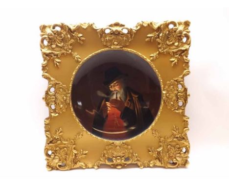 A late 19th/early 20th Century Austrian or German Plate decorated with scene of a bearded man smoking a pipe, fitted in an el