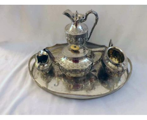 Silver plated oval Serving Tray containing a three-piece Tea Service and further non-matching Jug, largest piece 18" wide (5)