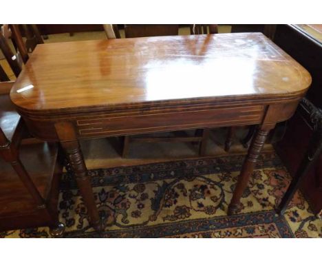 A 19th Century Mahogany and line inlaid D-shaped folding Card Table raised on turned legs, the interior with green baize lini