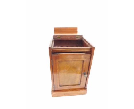 Edwardian Mahogany Smokers Cabinet of rectangular form with flip top lid and single door to front, the interior with pipe-hol