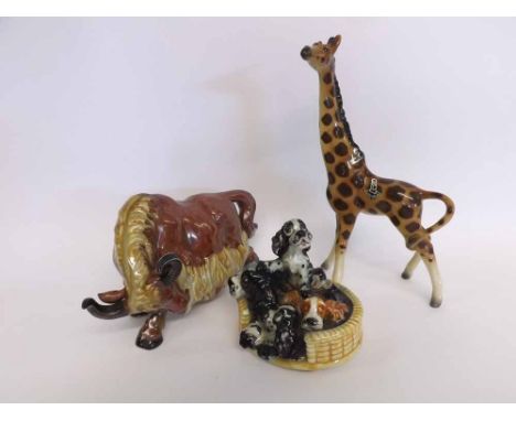 A Mixed Lot comprising: a Goebel Model of a basket of puppies, a further German Model giraffe and Studio Pottery Model yak, l