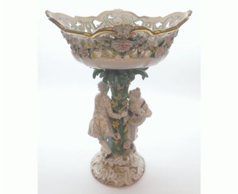 19th Century large Dresden centrepiece, the top with pierced sides and floral encrustations, raised on a naturalistic floral 